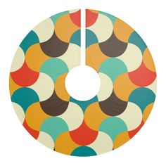 a multicolored circle shaped object on a white background with an orange, brown, and blue dot pattern