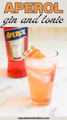 an aperol gin and tonic cocktail with orange garnish on the rim, next to a bottle of aperol gin and tonic