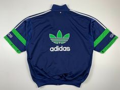 Vintage 90s Adidas Big Logo Spellout Track Top Jacket Blue Green Size L Condition: great Size Tag - L (check measurements) Length - 74cm Pit to Pit - 66cm Please check all Size Details and Photos! I am always open to offers! ______________________________________________ Worldwide: 10-25 business days.  (In rare cases the shipping time more than 25 days) Blue Track Jacket For Spring Streetwear, Casual Blue Track Jacket For Streetwear, Blue Urban Track Jacket For Spring, Urban Blue Track Jacket For Spring, 90s Style Blue Track Jacket For Fall, 90s Style Sports Outerwear With Crew Neck, Blue Retro Track Jacket For Spring, Blue Adidas Track Jacket For Spring, Adidas Blue Track Jacket For Spring