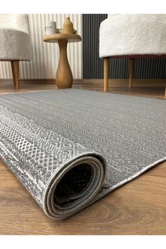 a large rug on the floor in a living room