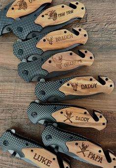 six knives with engraved names on them