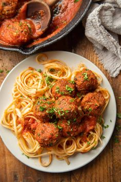 meatballs and spaghetti on a plate with the title vegan meatballs