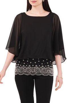 Bring instant glam to your look with a top framed by sheer, flowy sleeves and a scalloped border design of rhinestones and imitation pearls. Ballet neck Three-quarter sleeves Partially lined 95% polyester, 5% spandex Hand wash, line dry Made in the USA Elegant Embellished Party Tops, Glamorous Crystal Embellished Evening Tops, Chic Tops With Sheer Sleeves For Cocktails, Chic Tops With Sheer Sleeves For Cocktail, Chic Cocktail Top With Sheer Sleeves, Chic Embellished Evening Tops, Elegant Spring Blouse With Overlay, Elegant Embellished Summer Top, Elegant Embellished Tops For Spring