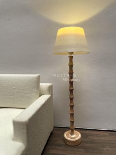 a lamp that is sitting next to a couch