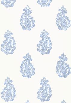 blue paisley wallpaper with white background and an intricate design on the back side of it