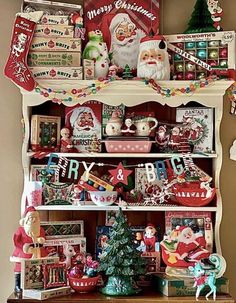 an old china cabinet is decorated with christmas decorations