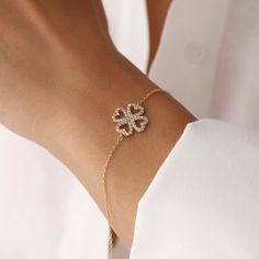 Adorn your wrist with our Dainty Clover Bracelet, a symbol of luck and elegance. This delicate piece features a charming four-leaf clover, beautifully crafted to add a touch of sophistication to any outfit. Perfect for layering or wearing solo, it's an ideal gift for bringing a bit of good fortune into everyday life S H O W ∙ Y O U R ∙ S T Y L E ♥ Customize your jewelry just for yourself and create your design. Wear it for everyday wear or for special occasions. 𝒫 𝐸 𝑅 𝐹 𝐸 𝒞 𝒯 ∙ 𝒢 𝐼 𝐹 ? Delicate Friendship Bracelet Jewelry, Elegant Heart Bracelet For Friendship, Delicate Diamond Bracelet With Adjustable Chain As Gift, Elegant Charm Bracelet With Bracelet Strap For Friendship, Elegant Charm Bracelet For Friendship, Dainty Adjustable Diamond Bracelet As Gift, Dainty Diamond Bracelet With Adjustable Chain, Dainty Diamond Bracelet With Adjustable Chain As Gift, Dainty Jubilee Crystal Bracelet As Gift