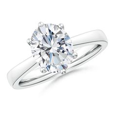 a white gold engagement ring with a round cut diamond in the center, on a white background