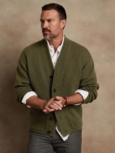 Made from a blend of extra fine Merino wool, this soft and warm cardigan is knitted in a subtly textured half-Milano stitch, which adds soft structure for refined appeal.  OVERSIZED FIT: Relaxed, boxy fit with a dropped shoulder.  Standard fit.  Long Knitted Jacket Men, Cardigan Sweater Men, Cardigan Sweater Outfit Men, Wool V-neck Cardigan For Layering, Classic V-neck Sweater Coat For Layering, Wool Knitted Sweater Coat For Layering, Cozy Wool V-neck Sweater For Work, Knitted Wool Sweater Coat For Layering, Classic V-neck Soft Knit Outerwear