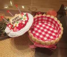 two birthday cakes sitting on top of a table