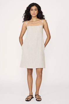 Elevate your style with our mini dress—a chic and versatile piece that features a square neckline, adjustable straps for the perfect fit, and a vent at the back for ease of movement. Completing the look is a practical side zip, ensuring both style and convenience for any occasion. Made with organic linenLined with organic cottonHandmade in IndiaMachine wash cold on delicate cycle, lay flat to dry, warm iron as needed Honoring Earth + Maker Each of our wovens are handcrafted in India, preserving Linen Mini Dress With Adjustable Straps, Sundress Midi Dress With Adjustable Straps, Sundress With Straight Neckline And Straps, Straight Neckline Sundress With Straps, Straight Neckline Suspender Sundress With Straps, Chic Linen Mini Dress With Spaghetti Straps, Sundress Mini Dress With Straight Neckline And Straps, Day Out Dress With Adjustable Straps And Straight Neckline, Mini Linen Dress With Adjustable Straps