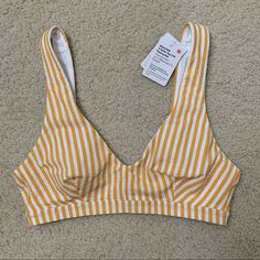 Lululemon Swim Bikini Top Size Xs Yellow/White Stripes Brand New With Tags Comes From A Pet Free/Smoke Free Home Yellow Seamless Swimwear For Poolside, Yellow Seamless Swimwear For Spring, Yellow Seamless Swimwear For Beach Season, Sporty Yellow Swimwear For Workout, Sporty Yellow Workout Swimwear, Yellow Swimwear With Built-in Bra For Beach Season, Yellow Summer Swimwear For Sports, Yellow Summer Sports Swimwear, Sporty Yellow Swimwear For Spring