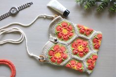 Elevate your style with our African Flower Granny Square Crochet Sling Bag - a charming and versatile accessory that blends classic craftsmanship with a touch of boho chic. Handcrafted with love and attention to detail, this unique bag is perfect for those who appreciate the art of crochet and the beauty of granny square patterns. The bag features the classic granny square pattern, which has been cherished for generations. It adds a touch of nostalgia and warmth to your style. The bag is just the right size to carry your daily essentials, from your phone and wallet to a book and a water bottle. It's a versatile companion for your on-the-go lifestyle. Bag dimensions : 18cm by 24 cm Strap: 52 inches long Care Instructions: Hand wash with a teaspoon of mild detergent; Rinse with cold water; H African Flower Granny Square, Flower Granny Square Crochet, Boho Sling Bag, Sling Bag Crochet, Granny Square Crochet Bag, Square Crochet Bag, Crochet Sling Bag, Crochet Crossbody Bag, Handbag Crochet