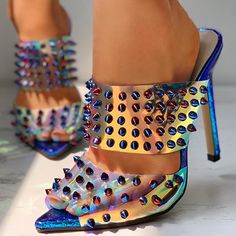 Step into the future with these Women's Holographic Pointed Toe Studded Decor Heeled Mules. Their trendy design combines holographic shine, pointed-toe elegance, and edgy stud embellishments for a fashion-forward look. Color: Multicolor Material: PVC Heel Type: Stiletto heel Heel height: 4.72" / 120 mm approx Product measurements were taken using size 8. Please note that measurements may vary by size. Toe: Pointed toe Rivet embellishment Handcrafted US sizing. Fits true to size. Multicolor Pointed Toe Heels For Party, Iridescent Heels For Spring, Spring Party Pointed Heels, Iridescent Synthetic Heels, Trendy Spiked Pointed Toe Heels, Multicolor Pointed Toe Heels For Night Out, Summer Pointed Toe Heels With Spikes, Multicolor Heels For Night Out, Summer Spiked Pointed Toe Heels