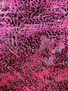 pink and black animal print fabric with silver foil on the bottom, in an abstract pattern