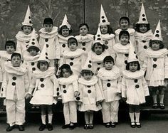 an old black and white photo of children dressed up as snowmen