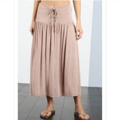 Expertly Crafted In Soft Jersey And Finished With A Washed Texture, Our Laced Maxi Skirt Is The Epitome Of Comfort And Style. The Laced Front Adds A Touch Of Elegance To This Everyday Essential, Making It A Versatile Choice For Any Occasion. Perfect For A Feminine And Effortless Look. Manufactured By Pol Clothing So You Know You Are Getting A Quality Product. 60 Cotton, 35 Polyester, 5 Spandex Beach Midi-length Gathered Skirt, Midi Length Gathered Skirt For Beach, Bohemian Midi-length Spring Bottoms, Bohemian Midi Length Spring Bottoms, Cotton Midi Bottoms For Vacation, Casual Rayon Maxi Skirt For Day Out, Solid Rayon Skirt For Summer, Summer Midi Bottoms For Brunch, Vacation Midi Length Gathered Skirt