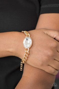 An oversized white gem attaches to a bold gold chain, creating a dramatic centerpiece atop the wrist. Features an adjustable clasp closure. Sold as one individual bracelet. P9RE-GDXX-163XX Paparazzi Accessories Jewelry, Jewelry Images, Paparazzi Accessories, Gold Bracelet Chain, White Rhinestone, Bracelet Clasps, Rhinestone Bracelet, Paparazzi Jewelry, Tiffany Heart