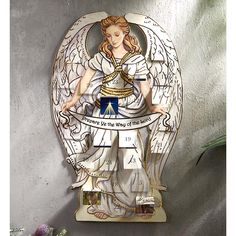 a clock with an angel on the front