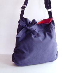 "Please check 'shop announcement' for production time and delivery before your purchase. This beautiful bag made from navy blue canvas. It is sturdy and big enough to hold lots of your essentials such as wallet, ipad, mobile, keys and a few pocket books. The bag is fully lined with burnt orange canvas. There are 2 open pockets, 1 zipper pocket, a pen slip and a key clip inside. The bag can be made with zipper closure instead of magnetic snap as shown in the listing. It also can be made larger or Pocket Books, Canvas Messenger Bag, Women Travel, Key Clip, Crossbody Bag Women, Blue Canvas, Tote Handbag, Handbag Purse, Bag Shoulder