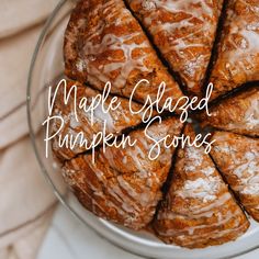 maple glazed pumpkin scones are arranged in a glass bowl on a white tablecloth