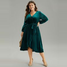 Shop Solid Velvet Belted Wrap Arc Hem Dress at BloomChic. Plus Size Clothing & Plus Size Dresses. BloomChic is a digital-first fashion and lifestyle destination for modern women sizes 10-30. Party Dress Classy, Sukienki Plus Size, Velvet Wrap Dress, 파티 드레스, Sleeve Pattern, Plus Size Kleidung, Midi Length Dress, Hem Dress, Sleeves Pattern