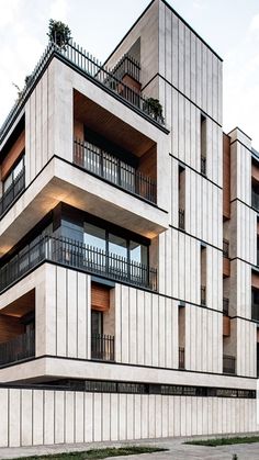 an apartment building with balconies and balconies on the second floor is shown