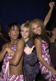 three young women standing next to each other