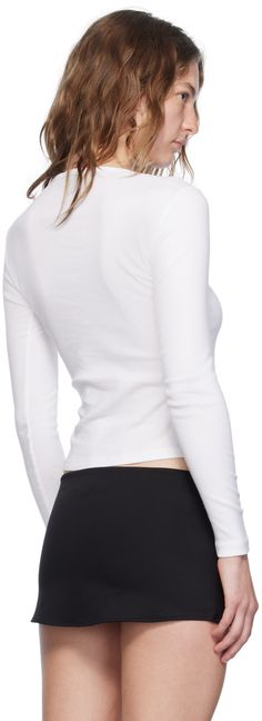 Cotton jersey T-shirt. Rib knit crewneck. Supplier color: White Casual White Turtleneck T-shirt, Ribbed Crew Neck T-shirt For Layering, Sporty Crew Neck T-shirt For Layering, Sporty Ribbed Crew Neck Tops, Cotton Crew Neck Top With Ribbed Cuffs, Spring Crew Neck Top With Ribbed Cuffs, Basic Crew Neck Tops With Ribbed Cuffs, Crew Neck T-shirt With Ribbed Cuffs, Fall T-shirt With Ribbed Crew Neck