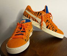 This PUMA Suede x Frosted Flakes Low sneaker is a must-have for any sneaker collector or fan of Tony the Tiger. The shoe features a bright orange color and low-top shaft style, making it perfect for a variety of activities such as cycling, basketball, and skateboarding. It is available in size 6.5 for both men and women. The sneaker is made of suede material and has a PUMA X product line. It also comes with a style code of 388018-01 and was released in 2022. This athletic shoe is suitable for various performance and activities such as golfing, hiking, and walking. Don't miss out on adding this unique and stylish sneaker to your collection! Tony The Tiger, Athletic Shoe, Sneakers Athletic, Puma Suede, Puma X, The Tiger, Suede Material, Low Sneakers, Running Training