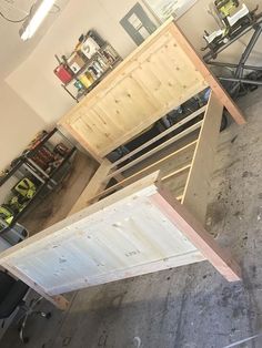 an unfinished table being built in a garage