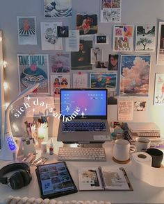 a laptop computer sitting on top of a desk