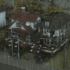 an aerial view of a house in the rain