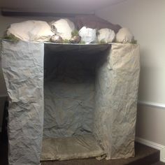 there is a large piece of paper on top of a shelf with rocks in it