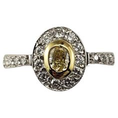 a yellow and white diamond ring