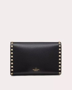 Valentino Garavani Small Rockstud Grainy Calfskin Crossbody Bag in Nero Hook closure Adjustable shoulder strap Interior: open slip pocket Platinum-finish metal studs and hardware Calfskin exterior Cotton lining 8.9" W x 5.9" H x 2.4" D Strap drop: 21.5” Made in Italy Luxury Shoulder Bag With Rivets, Elegant Evening Shoulder Bag With Rivets, Formal Leather Bags With Studs, Luxury Evening Shoulder Bag With Rivets, Designer Evening Bags With Rivets, Designer Formal Bags With Studs, Formal Black Shoulder Bag With Studs, Luxury Studded Formal Bags, Luxury Formal Bags With Studs