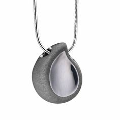 The TearDrop Pendant is exquisite, detailed, and meaningful. Shaped with inspiration from a single falling teardrop, it is a reminder of our emotions after we have lost someone. The teardrop is made from sterling silver 925, as is the 20-inch snake chain it comes with. The pendant has also been coated in a ruthenium plating, which gives it a smoked gray appearance. The two-tone effect comes from the etched effect on the edges of the teardrop, which contrast beautifully with its polished front su Minimal Necklace, Cremation Jewelry, Silver Snake Chain, Snake Chain, Dog Tag Necklace, Two Tone, Silver Necklace, Two By Two, Plating