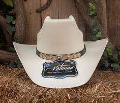 "Turn heads when you wear our beautiful handmade cowboy hat . -SIZE MEDIUM FITS  7 , 7 1/8 ,  SIZE LARGE  7 1/4 , 7 3/8 -CROWN 4 1/2 \" -BRIM 3 7/8\"" Western Adjustable Top Hat For Rodeo, Western Style Adjustable Top Hat For Rodeo, Country Style Top Hat For Rodeo With Flat Crown, Country Style Top Hat With Flat Crown For Rodeo, Western Style White Top Hat With Flat Crown, Country Style Flat Crown Top Hat For Rodeo, Western Top Hat For Rodeo, Custom Hat Bands For Rodeo, One Size Fits Most, Western Handmade Felt Hat For Ranch