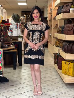 This Beautiful Mexican Golden Embroidered Floral Dress is the perfect dress for a fun night out or a special event. It is full of elegant Golden embroidered flowers and has some crocheted details. This dress has ties on the back in order to adjust the fit. Available size: S - 2x The earrings is available to buy here https://www.etsy.com/es/listing/673012637/aretes-mexicanos-de-filigrana-aretes?ref=shop_home_active_7&pro=1&frs=1 Chic Fitted Short Sleeve Embroidered Dress, Chic Fitted Embroidered Dress With Short Sleeves, Embroidered Embellished Short Sleeve Dress For Party, Embroidered Embellished Short Sleeve Dress, Embellished Embroidered Short Sleeve Dress, Short Sleeve Embellished Embroidered Party Dress, Party Embellished Embroidered Dress With Short Sleeves, Chic Embroidered Dresses For Night Out, Party Dress With Gold Embroidery