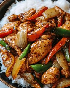 chicken and vegetable stir fry with rice in a bowl