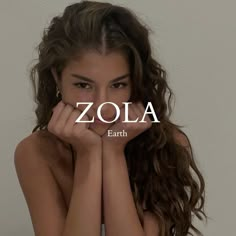 a woman with her hands on her face and the word zola in front of her