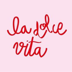 the word la dolce vita written in red ink on a pink background with black lettering