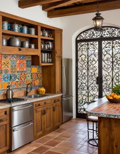 a kitchen with wooden cabinets and tile backsplash