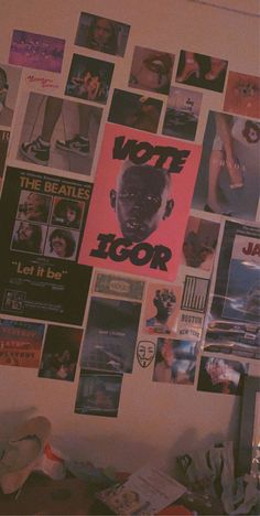 a wall covered in posters and pictures