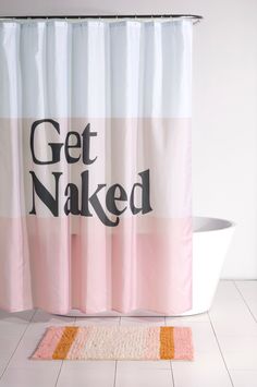 a pink and white shower curtain with the words get naked on it next to a bathtub