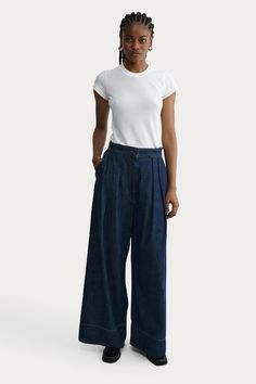 An RC go-to pant, the Coxsone is an easy, pleated, high-waisted trouser with a wide leg, cut this season in Vista Denim. 100% Cotton Faux button fly Invisible side zipper Elastic waistband at back Side slip pockets Made in USA Dark Indigo, Rachel Comey, Colored Denim, High Waisted Trousers, Summer Collection, Side Zipper, Made In Usa, Wide Leg, Trousers