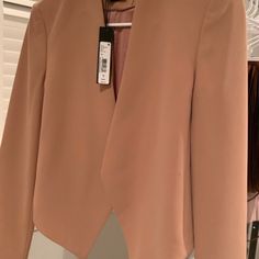 Alice + Olivia Roxanne Collarless Jacket Coat Color: Dusty Rose Tan Gorgeous Cropped Blazer. Open-Front. Slim, Streamlined Silhouette, Stand Collar, Long Sleeves, Polyester Fabric And Satin Lining. Lightweight. Lined. Super Chic With On Trend Details! Versatile Piece Can Be Dressed Up, Or Down, For Work Or A Night On The Town. Looks Fab With High Waisted Jeans And Heels. Size 4. About 21" From Shoulder To Hem Model Shown Is 5'10" (177cm) Wearing Us Size 4. Brand New Without Tag. Never Worn. See Feminine Pink Outerwear For Evening, Chic Pink Evening Outerwear, Tailored Outerwear For Spring Night Out, Tailored Outerwear For Night Out In Spring, Chic Pink Outerwear For Formal Occasions, Feminine Formal Spring Outerwear, Feminine Formal Outerwear For Spring, Pink Outerwear For Evening In Fall, Pink Fall Evening Outerwear