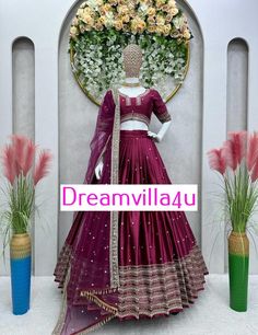 Lehenga Fabric: Japan Satin Work: Thread with Sequins Size: Up to 44 inches Inner Fabric: Crepe Type: Semi-Stitched Flair: 3 meters (includes canvas patta and cancan) Choli Fabric: Japan Satin Work: Zari with Sequins Size: Up to 42 inches (Un-Stitched) Dupatta Fabric: Butterfly Net Work: Zari with Sequins and Fancy Lace Border on Two Sides Size: 2.20 meters Weight Total Weight: 1.3 kg Party Satin Traditional Wear With Zari Work, Traditional Satin Sets For Diwali, Satin Traditional Wear With Pallu For Wedding, Satin Dresses For Weddings And Festivals, Floor-length Satin Fitted Choli, Fitted Satin Dresses For Festivals, Wedding Dresses In Satin For Festivals, Satin Wedding Dress For Festivals, Traditional Satin Wear With Pallu For Reception