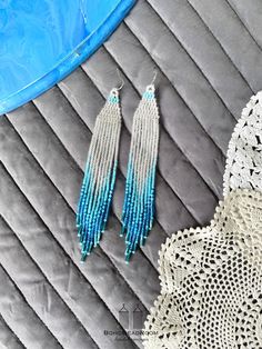 "These are bohemian bridal beaded earrings made with love for you. It also makes an excellent gift for birthdays, anniversaries, mother's day, valentine's day and more. ♡ Bead Length - 5.5\" (14 cm) ♡ Total Length - 5.9\" (15 cm) ♡ Width - 0.8\" (2 cm) ♡ Quality Czech beads If you like these white and turquoise seed bead earrings, but would like them in a different color please email me and I do special orders. I accept payments through Paypal. The colors can slightly differ from the photo becau Beaded Fringe Dangle Jewelry For Beach, Beach Dangle Jewelry With Beaded Fringe, Bohemian Silver Beaded Earrings With Tiny Beads, Turquoise Beaded Dangle Chandelier Earrings, Turquoise Tassel Earrings With Dangling Beads, Turquoise Beaded Tassel Earrings For Festival, Adjustable Beaded Turquoise Chandelier Earrings, Bohemian Silver Beaded Earrings, Bohemian Turquoise Beaded Fringe Earrings