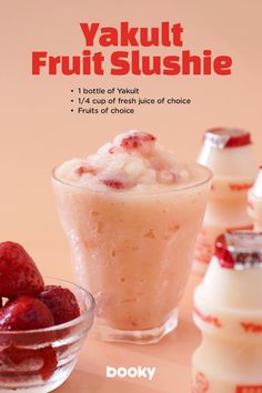 yogurt fruit slushie in small glass bowls next to milk and strawberries